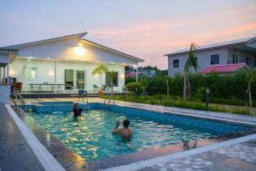 Which are the best locations for buying a farmhouse in Noida?